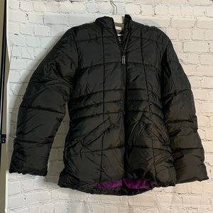 Black puffer with purple fur on the inside